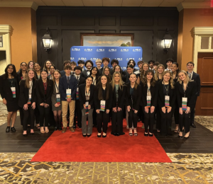 Students posed for a photo in front of the red carpet at FBLA. So many of Dallastown's students were able to attend the conference, barely fitting in the photo. Photo submitted by FBLA Advisers